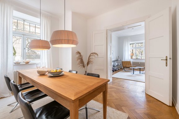 A picture-perfect historic double door divides living and dining room