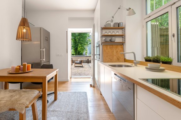 The private terrace adjoins the cozy kitchen-living room