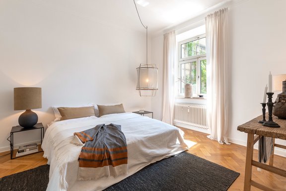 The bedroom faces the south-east terrace away from the street