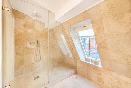 Walk-in glass shower in master bath