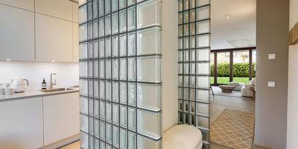 New build: Corner house with sunbathing island in private garden and lake view