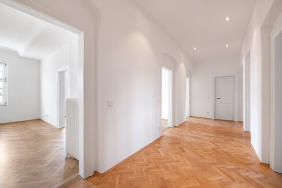 Spacious hallway with ceiling spotlights