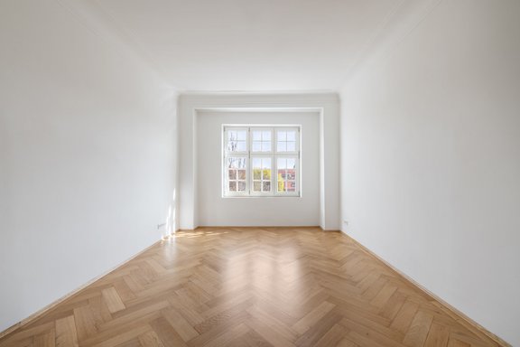 Bedroom with original herringbone parquet flooring