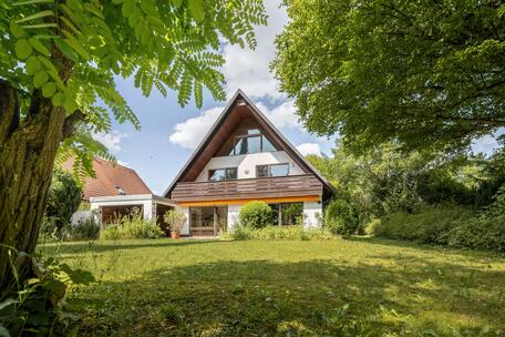 Single-family home with a large, sunny yard and plenty of potential for remodeling