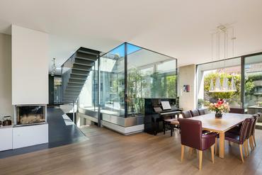 Exclusive, energy-efficient architect-designed house with glass atrium and flexible room layout