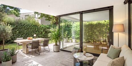 A Garden Idyll in a Prime Location in Herzogpark: Exclusive 3.5-room apartment in a modern designer villa