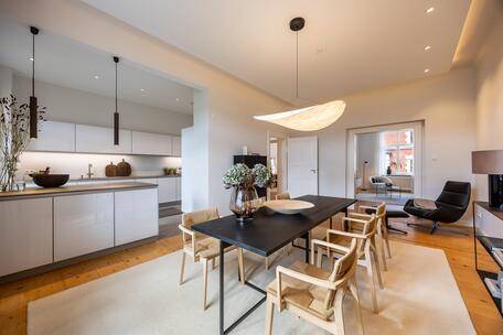 Historic Charm: Renovated 4-room apartment with a southwest-facing balcony and a fireplace