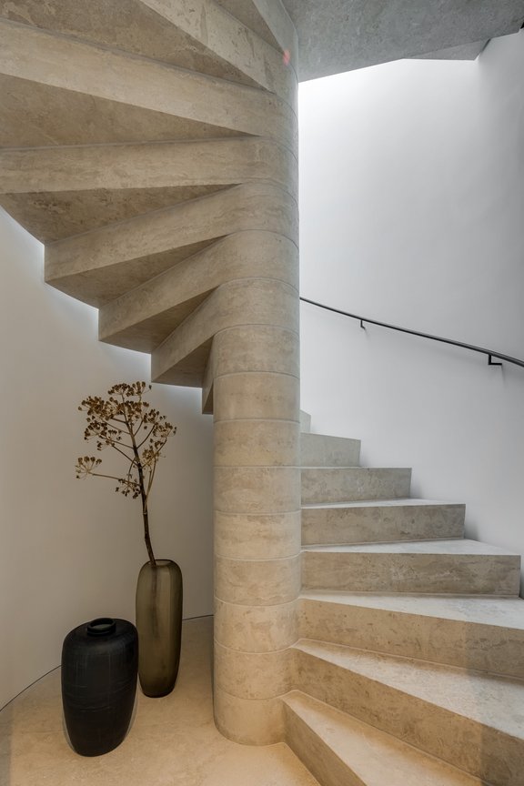 Fan-shaped staircase made of natural stone blocks