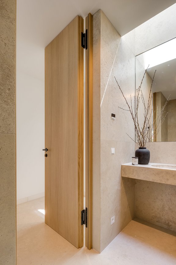 Modern wooden doors complete the new construction arm