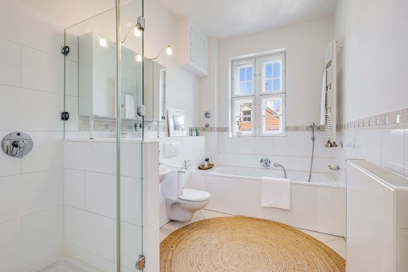Timeless modern bathroom with tub and shower
