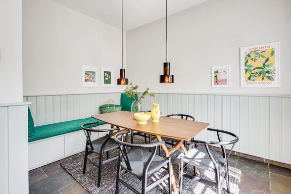 Panelled walls and a bench provide comfort