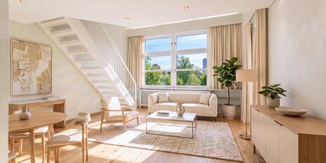 Exclusive attic apartment with a loft: Spacious living area and south-facing windows—needs renovation