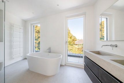 Master bathroom with shower and free-standing bathtub