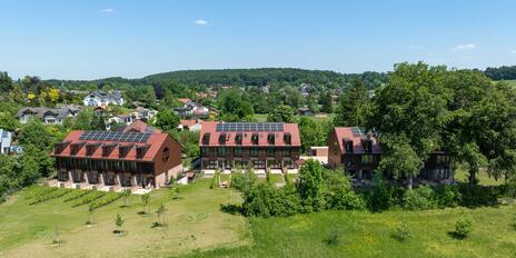 New Construction: Mid-house with a private sun deck in an idyllic location and lake views