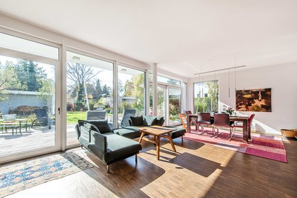 Light-flooded living and dining area