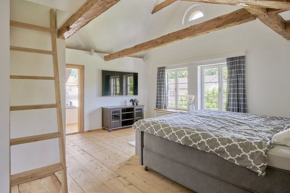 Master area with wooden beams