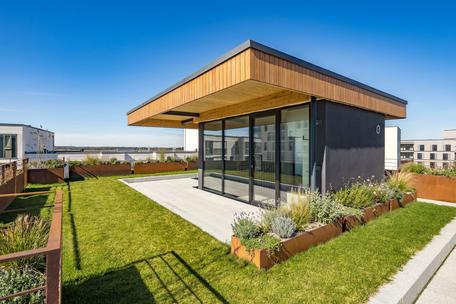 Stylish 4-bedroom duplex apartment with a "house-within-a-house" feel and a rooftop garden with panoramic views