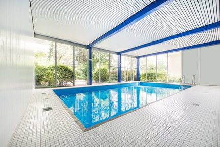Swimming pool flooded with light