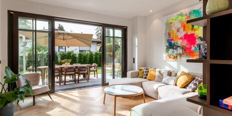 Half of a villa with luxurious amenities and a stunning garden in a prime location