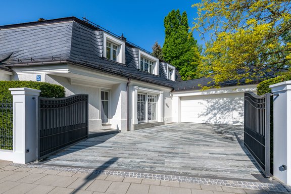 The double garage and driveway offer space for up to four cars